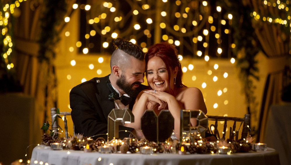 beautiful wedding shot of bride and groom laughing at balbirnie house